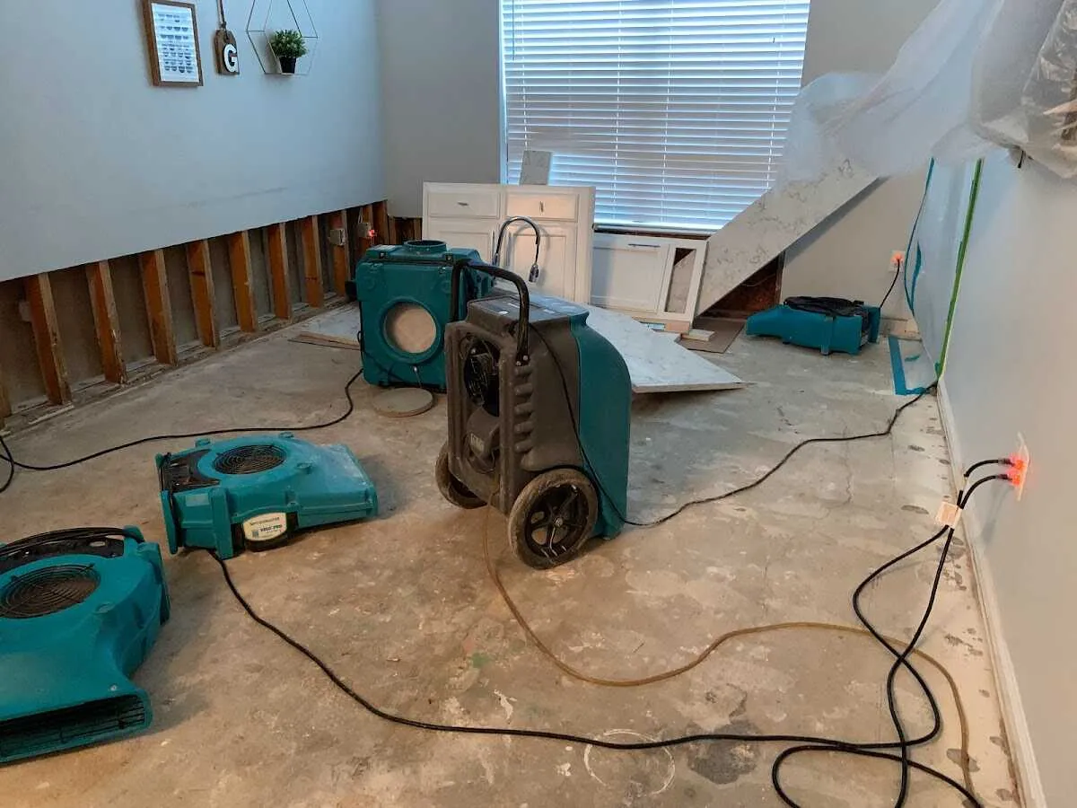 Dehumidifier in flood-cut room for Water Damage Restoration in Warsaw